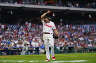 Philadelphia Phillies starting pitcher Aaron Nola wipes his face after pitching during the second inning of a baseball game against the Los Angeles Dodgers, Tuesday, Aug. 10, 2021, in Philadelphia. (AP Photo/Matt Slocum)