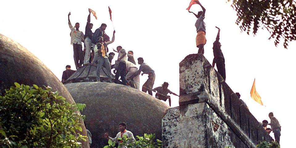 Kar sevaks atop the Babri Masjid shortly before it was demolished on December 6, 1992 at Ayodhya. Photo: Sanjay Sharma/Hindustan Times via Getty Images