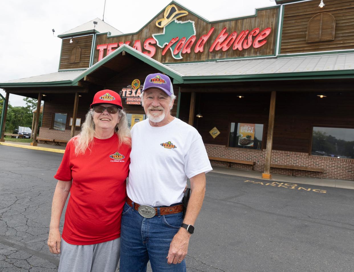Judy and Mike McNamara of Franklin, Virginia, pose for a photo before their meal at the Texas Roadhouse in Alliance. They are visiting every Texas Roadhouse in the country.