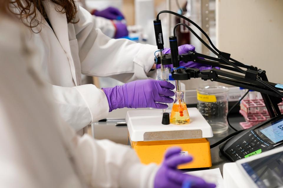 A water researcher tests a sample of water for PFAS, Tuesday, Feb. 14, 2023, at the U.S. Environmental Protection Agency Center For Environmental Solutions and Emergency Response in Cincinnati. The Environmental Protection Agency is expected to propose restrictions on harmful 