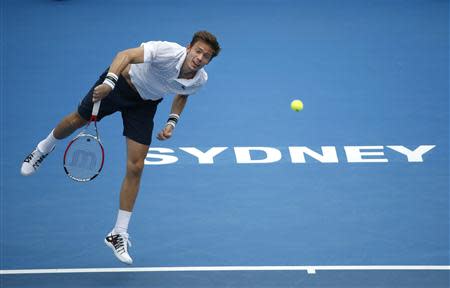 Nicolas Mahut of France serves to Juan Martin Del Potro of Argentina during their second round men's singles match at the Sydney International tennis tournament in Sydney, January 8, 2014. REUTERS/Jason Reed