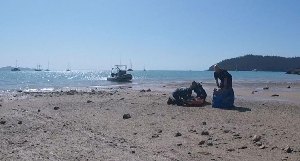 Picture of RACQ paramedics tending to 12-year-old Hannah Papps who was attacked by a shark in 2018.