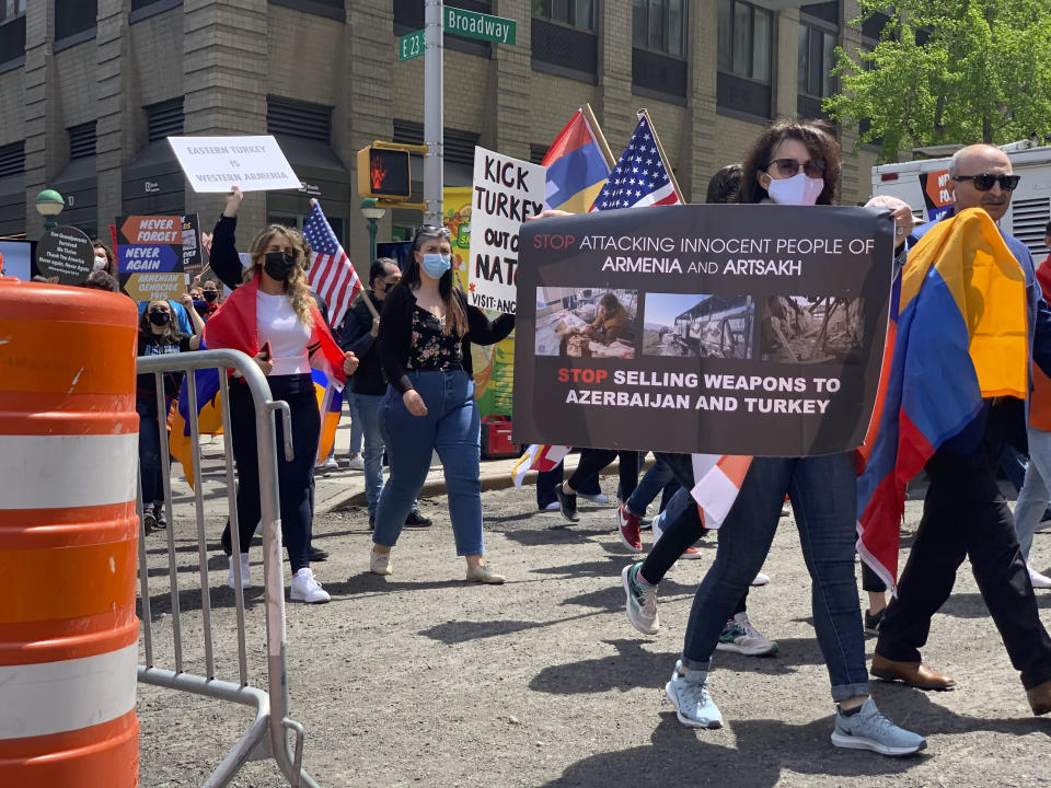 Demonstrators march in a rally protesting against Armenian genocide on 23rd Street crossing over Broadway, Saturday, April 24, 2021, in New York. The United States is formally recognizing that the systematic killing and deportation of hundreds of thousands of Armenians by Ottoman Empire forces in the early 20th century was “genocide” as President Joe Biden used that precise word that the White House has avoided for decades for fear of alienating ally Turkey. (AP Photo/Pamela Hassell)