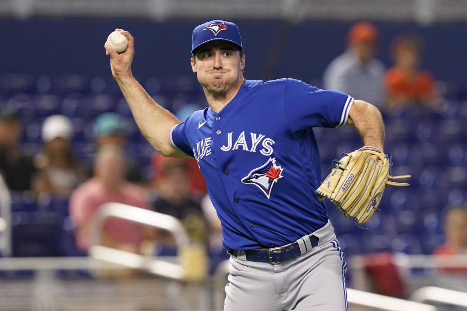 Toronto Blue Jays starting pitcher Ross Stripling throws to first base after catching a ball during the first inning of a baseball game against the Miami Marlins, Tuesday, June 22, 2021, in Miami. (AP Photo/Marta Lavandier)