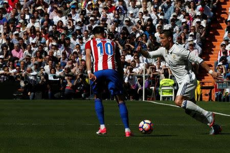 Football Soccer - Real Madrid v Atletico Madrid - Spanish La Liga Santander - Santiago Bernabeu Stadium, Madrid, Spain - 8/04/17 - Real Madrid's Cristiano Ronaldo and Atletico Madrid's Yannick Ferreira-Carrasco in action. REUTERS/Juan Medina