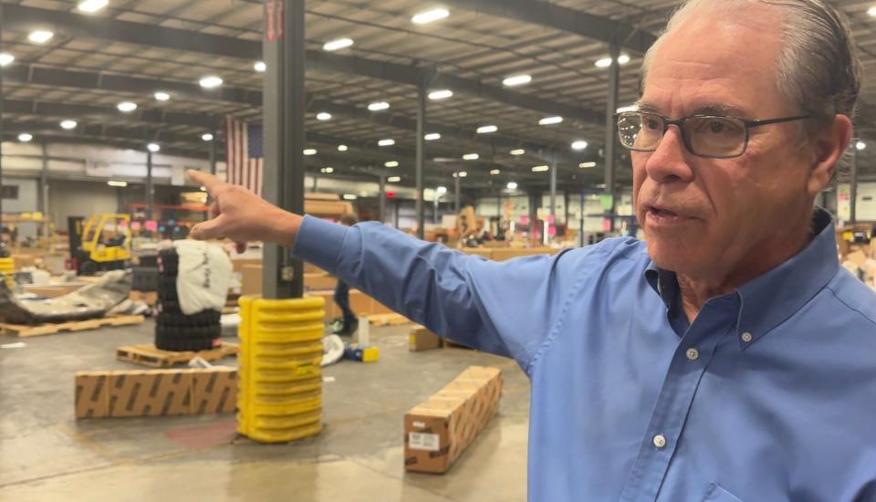 U.S. Sen. Mike Braun walks through one of Meyer Distributing's warehouses in Jasper, Indiana, on March 9, 2024. Braun, the company's former CEO, is running for governor of Indiana.