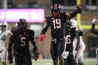 Maryland defensive lineman Donnell Brown (19) celebrates after he made an interception against Virginia during the second half of an NCAA college football game Friday, Sept. 15, 2023, in College Park, Md. Maryland defensive lineman Quashon Fuller is at left. (AP Photo/Nick Wass)