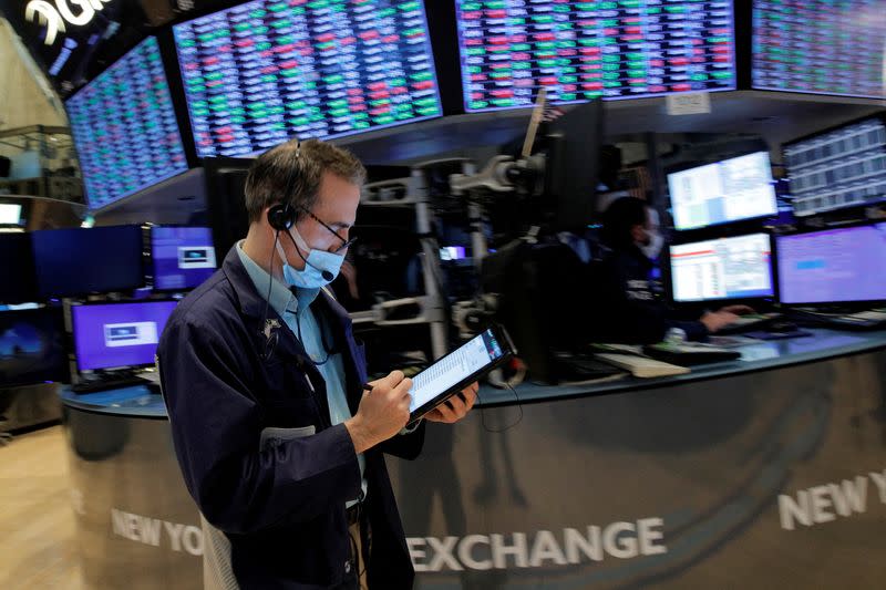 Traders work on the floor of the NYSE in New York