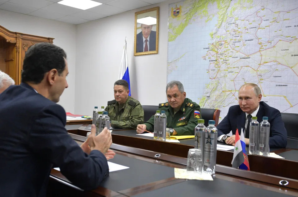 FILE - From right, President Vladimir Putin, Defense Minister Sergei Shoigu and Lt. Gen. Alexander Chaiko listen to Syrian President Bashar Assad during a meeting in Damascus, Syria, Tuesday, Jan. 7, 2020. (Alexei Druzhinin/Sputnik, Kremlin via AP, Pool, File)