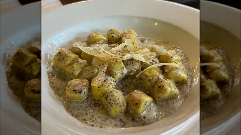Gnocchi with truffle on white plate
