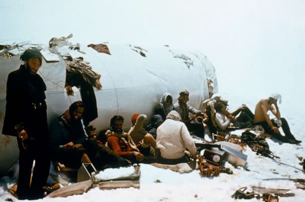 PHOTO: Survivors sitting outside the fuselage. According to Eduardo Strauch, they would speak to each other in low volumes to conserve energy. (Obtained by ABC News)