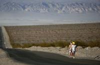 Competitors run in the Badwater Ultramarathon in Badwater Ultramarathon at the Death Valley National Park, California in this July 15, 2013 file photo. An ultramarathon involves a combination of running and walking further than the traditional marathon of 26.2 miles (42.2 kilometres). Though most ultras cover distances of either 50 or 100 miles, many are much longer. For the ultramarathoner, it is all about running for joy, setting personal goals and trying to overcome every obstacle faced. To match ATHLETICS-ULTRAMARATHONS/ REUTERS/Lucy Nicholson/Files (UNITED STATES - Tags: SPORT ATHLETICS)