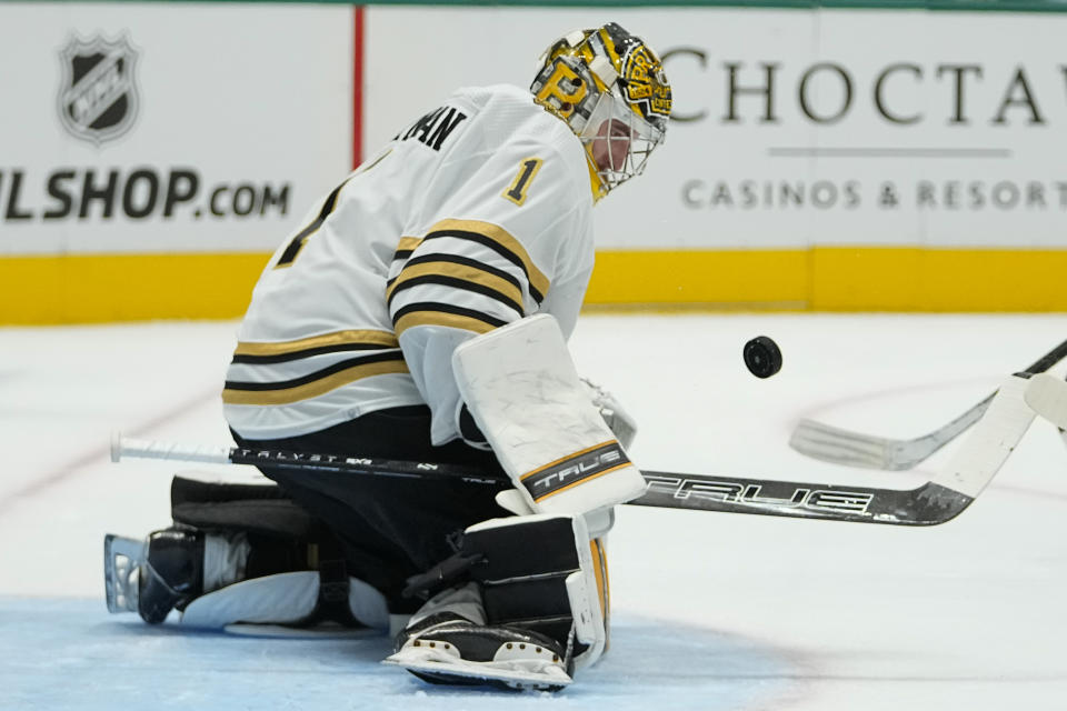 Boston Bruins goaltender Jeremy Swayman blocks a shot by the Dallas Stars during the first period of an NHL hockey game, Monday, Nov. 6, 2023, in Dallas. (AP Photo/Julio Cortez)