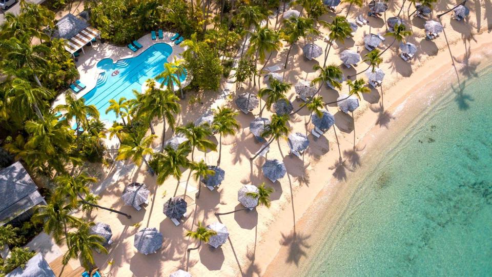 Aerial view of the beach and pool at Curtain Bluff resort, voted one of the best resorts in the Caribbean