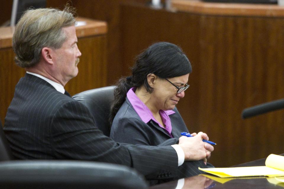 Ana Trujillo sits with her lawyer, Jack Carroll, during closing arguments in the punishment phase of her trial on Friday, April 11, 2014, in Houston. Trujillo was convicted on April 8, of murder for fatally stabbing her boyfriend 59-year-old Alf Stefan Andersson with the stiletto heel of her shoe during an argument last June at his Houston condominium. (AP Photo/Houston Chronicle, Brett Coomer) MANDATORY CREDIT