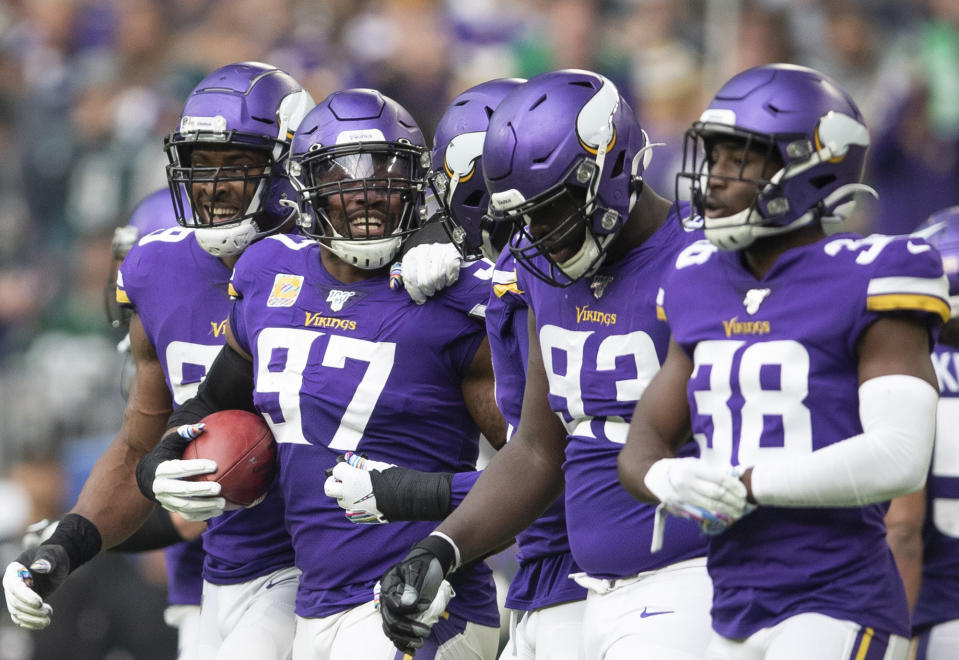 Minnesota Vikings defensive end Everson Griffen (97) celebrates his interception with teammates against the Philadelphia Eagles in the second quarter of an NFL football game, Sunday, Oct. 13, 2019, in Minneapolis. (Jerry Holt/Star Tribune via AP)