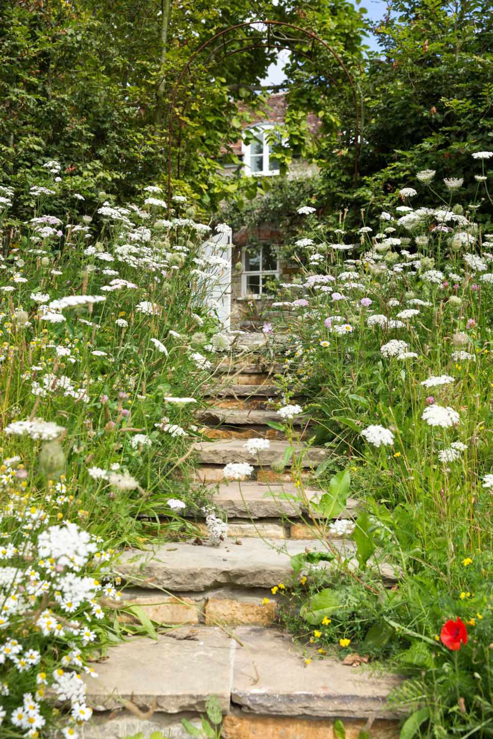<p> No garden approach can be more romantic than threading your way through swaying meadow grasses and flowers up the garden steps. Few of us are lucky enough to have this very situation at home though, so we need to be a little creative.&#xA0; </p> <p> Reclaimed flagstones make the perfect steps for cottage gardens. Already worn and marked by years of use, they can be set into an existing slope, supported by salvaged bricks, to create a pathway full of personality.&#xA0; </p> <p> Cover the neighboring banks of soil with easy-to-lay matting pre-sown with native flowering meadow grasses. If you are more impatient, go for plug plants interspersed with more mature perennials right next to the steps.&#xA0; </p>