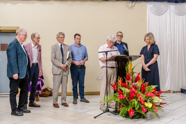 <p>Reynaldo Bernard</p> Laura Trevelyan, far right, with members of her family signing their letter of apology in Grenada