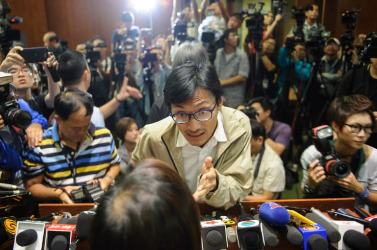 Lawmaker Eddie Chu argues with a pro-Beijing counterpart after members of the group walked out of the Legislative Council to block the second swearing-in of pro-democracy lawmakers in Hong Kong