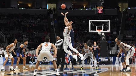 Mar 24, 2019; San Jose, CA, USA; Virginia Tech Hokies forward Kerry Blackshear Jr. (24) and Liberty Flames forward Scottie James (31) go up for the opening tip during the first half in the second round of the 2019 NCAA Tournament at SAP Center. Mandatory Credit: Kelley L Cox-USA TODAY Sports
