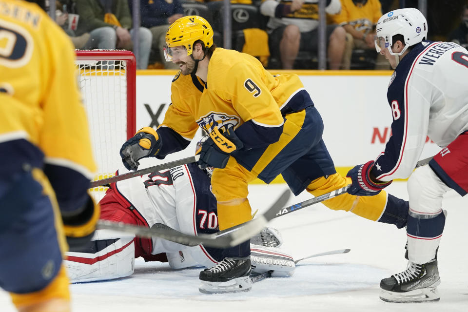 Nashville Predators left wing Filip Forsberg (9) scores his fourth goal of the game against the Columbus Blue Jackets in the second period of an NHL hockey game Tuesday, Nov. 30, 2021, in Nashville, Tenn. (AP Photo/Mark Humphrey)