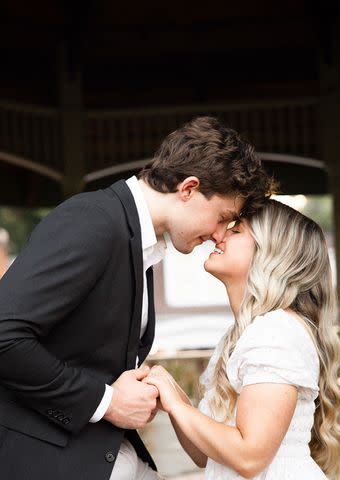 <p>Kamryn Bell Photography</p> Kaleigh and Justin smiling after getting engaged