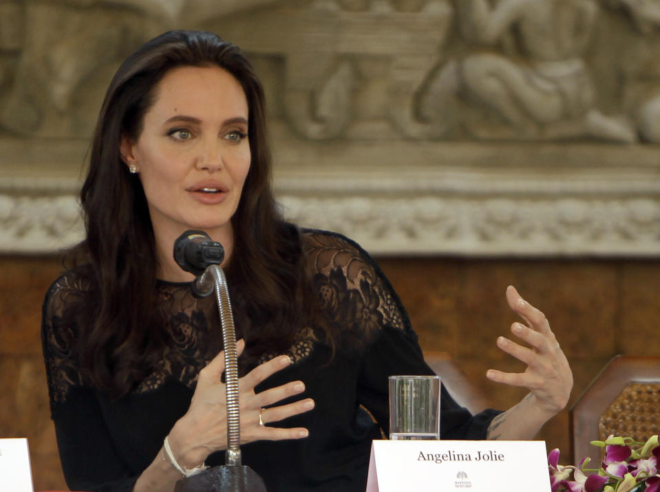 Hollywood actress Angelina Jolie gives a press conference in Siem Reap province, Cambodia, Saturday, Feb. 18, 2017. Jolie on Saturday launches her two-day film screening of "First They Killed My Father" in Angkor complex in Siem Reap province. (AP Photo/Heng Sinith)