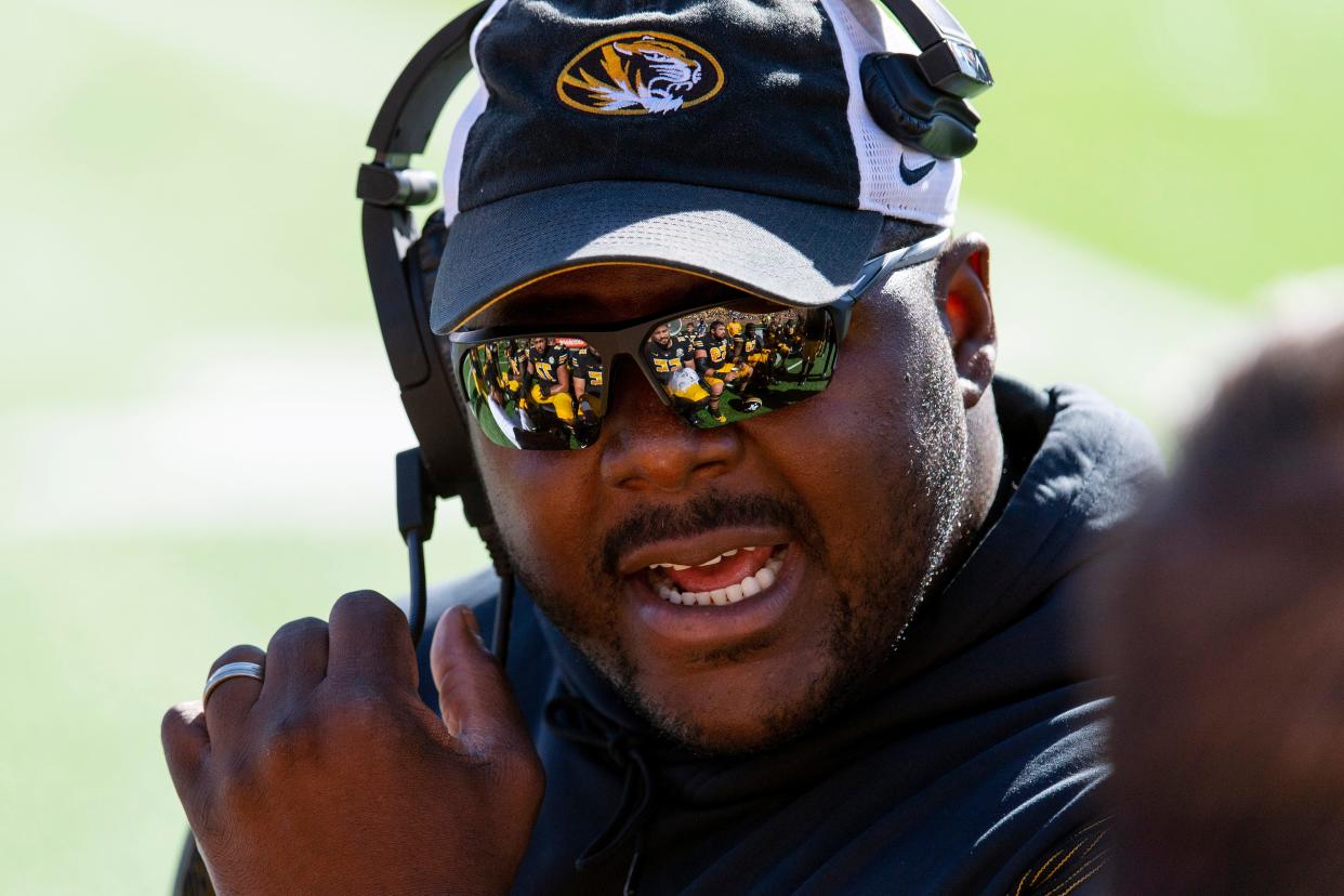 Missouri assistant coach Marcus Johnson talks to his offensive line during the first quarter of an NCAA college football game against Texas A&M Saturday, Oct. 16, 2021, in Columbia, Mo.