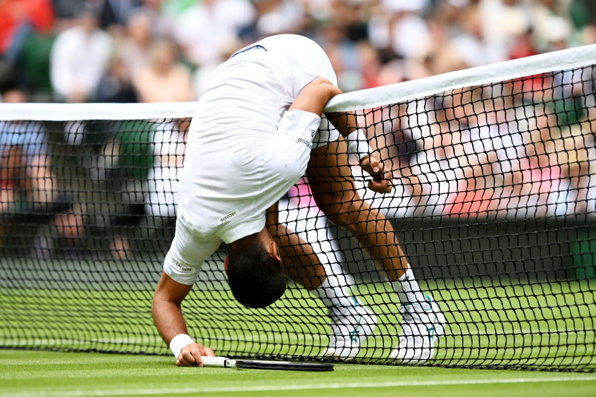 Djokovic lost the point after falling into the net before the ball was out (Getty Images)