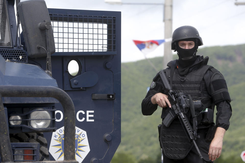 Kosovo police special unit members secure the area near the village of Cabra, north western Kosovo, during an ongoing police operation on Tuesday, May 28, 2019. A Kosovo police operation against organized crime in the north, where most of the ethnic Serb minority lives, has sparked tension, and Serbia ordered its troops to full alert. (AP Photo/Visar Kryeziu)