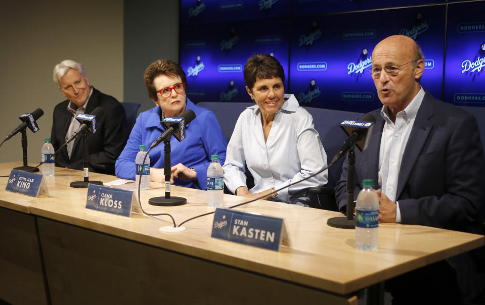 Los Angeles Dodgers president and CEO Stan Kasten, right, and owner and chairman Mark Walter, left, introduce to the baseball team ownership group, tennis champions Billie Jean King, second from left, and her partner, Ilana Kloss, at a news conference in Los Angeles, Friday, Sept. 21, 2018. Pending approval by the WNBA, the two are also expected to have an ownership interest in the Los Angeles Sparks. (AP Photo/Alex Gallardo)