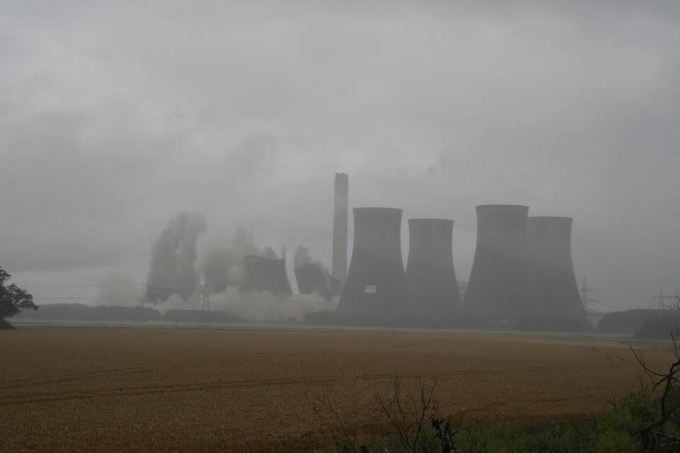 The cooling towers being demolished (Peter Byrne/PA) (PA Wire)