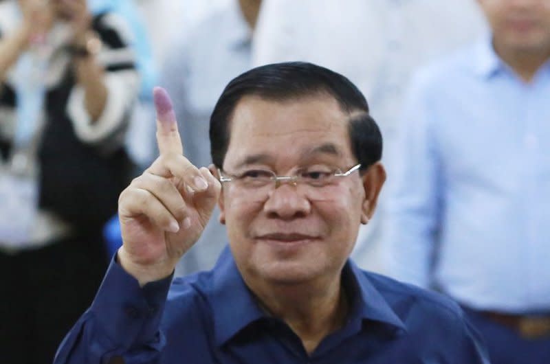 Cambodian Prime Minister Hun Sen, seen showing his inked finger after voting Sunday, claimed a landslide victory in an election the U.S. State Department called "neither free nor fair." Photo by Kith Serey/EPA-EFE