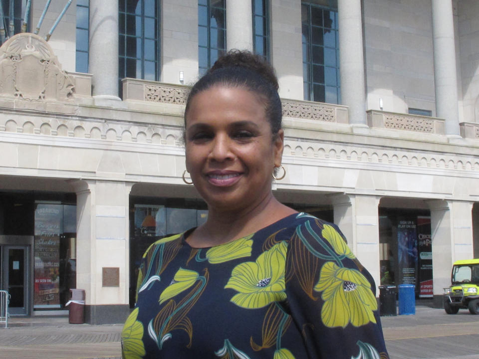 This Sept. 21, 2020, photo shows Melonie Johnson, president of the Borgata casino, posing for a photo on the Boardwalk in Atlantic City, N.J. On Oct. 26, 2021, participants in a gambling conference in Atlantic City said women are advancing in the U.S. casino industry but agreed more opportunities for advancement are needed. (AP Photo/Wayne Parry)