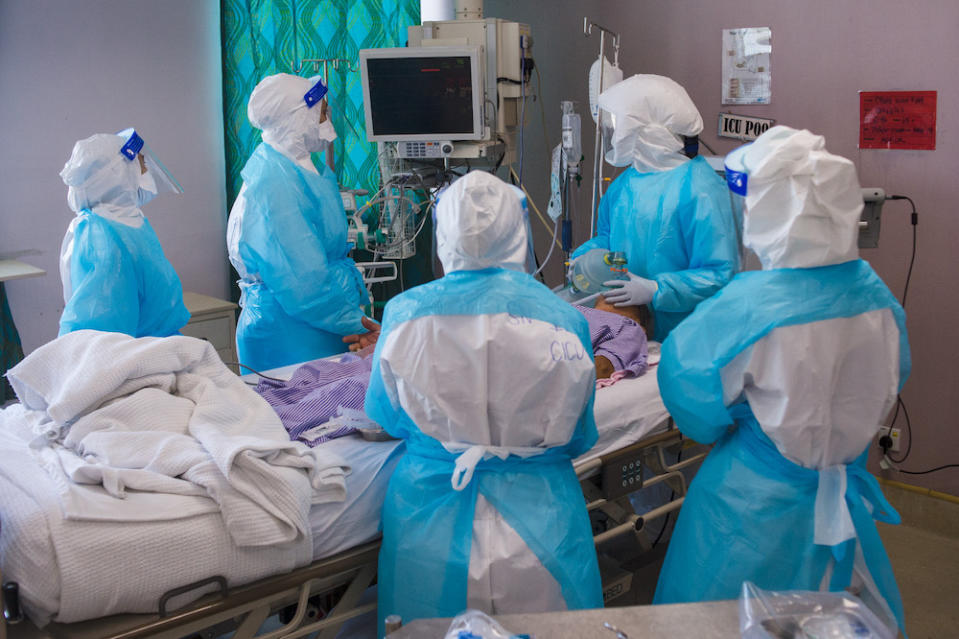 Healthcare workers perform the intubation procedure on a Covid-19 patient in Hospital Serdang’s ICU. — Picture by Shafwan Zaidon