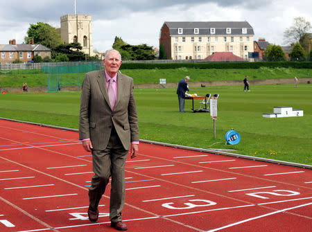 FILE PHOTO: Sir Roger Bannister walks over the same finish line at the Iffley Road running track in Oxford that he crossed fifty years ago when he was the first man to run the sub four minute mile, May 6, 2004. REUTERS/David Bebber/File Photo