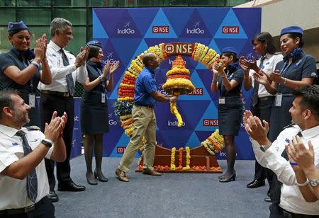 President of InterGlobe Aviation Limited Aditya Ghosh rings the ceremonial bell during the company's listing ceremony at the National Stock Exchange (NSE) in Mumbai, November 10, 2015. REUTERS/Danish Siddiqui