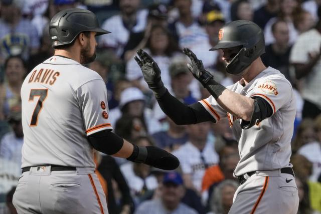 San Francisco Giants' J.D. Davis, right, is congratulated by