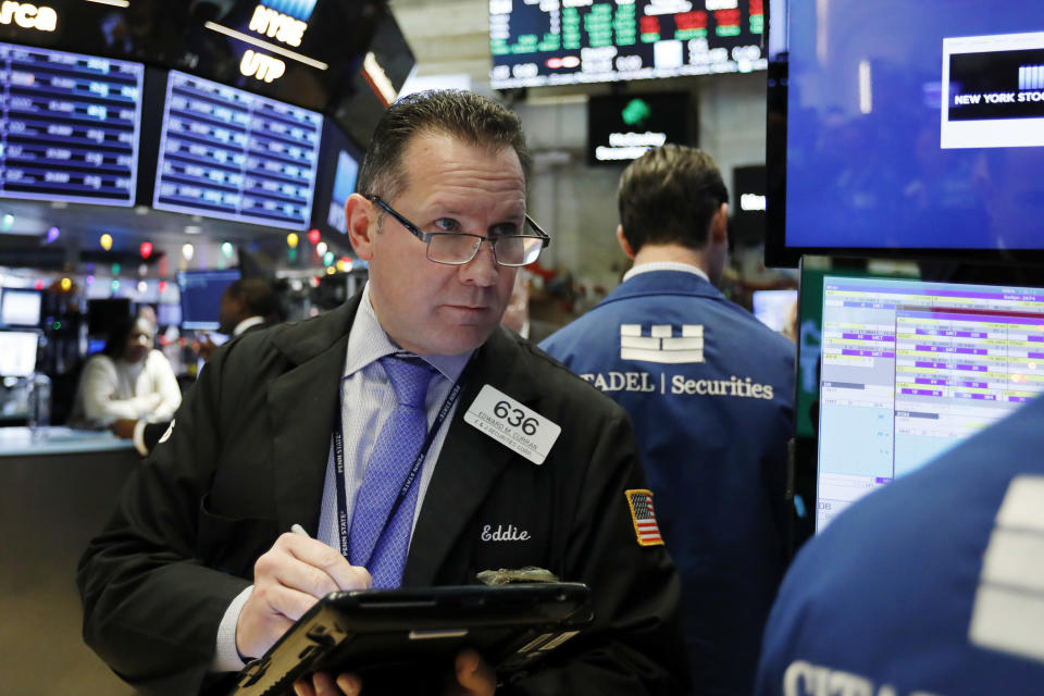 Trader Edward Curran works on the floor of the New York Stock Exchange, Thursday, Dec. 27, 2018. Wall Street's wild Christmas week goes on, with the Dow Jones Industrial Average slumping 300 points at the open Thursday, a day after notching its biggest-ever point gain. (AP Photo/Richard Drew)