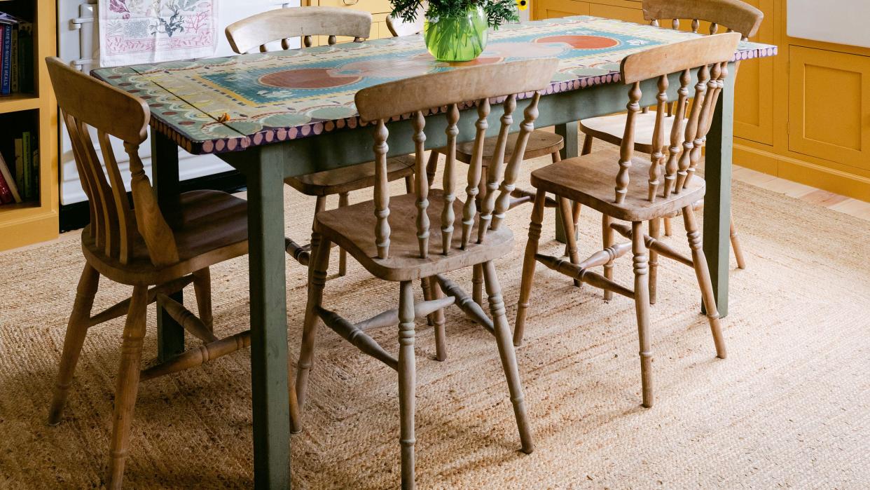 a dining room table with chairs