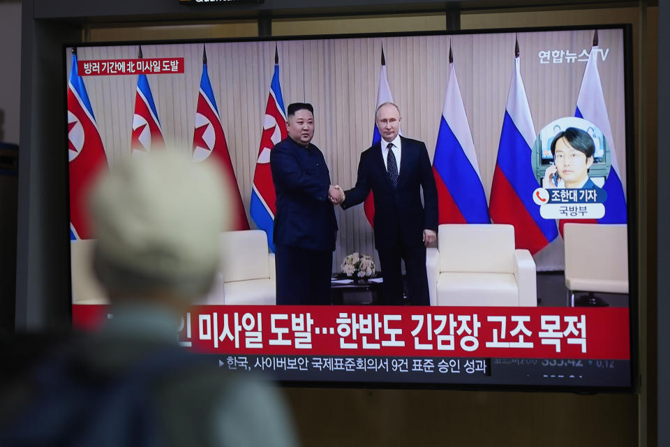 A TV screen shows a report of North Korea's ballistic missiles with file footage of a meeting between Russian President Vladimir Putin and North Korea's leader Kim Jong Un, during a news program at the Seoul Railway Station in Seoul, South Korea, Wednesday, Sept. 13, 2023. North Korea fired two ballistic missiles toward the sea Wednesday, as leader Kim Jong Un rolled through Russia on an armored train toward a meeting with President Vladimir Putin. (AP Photo/Lee Jin-man)