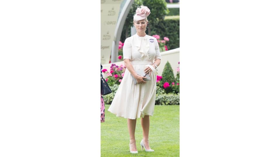 Zara Tindall in pale dress and pink fascinator