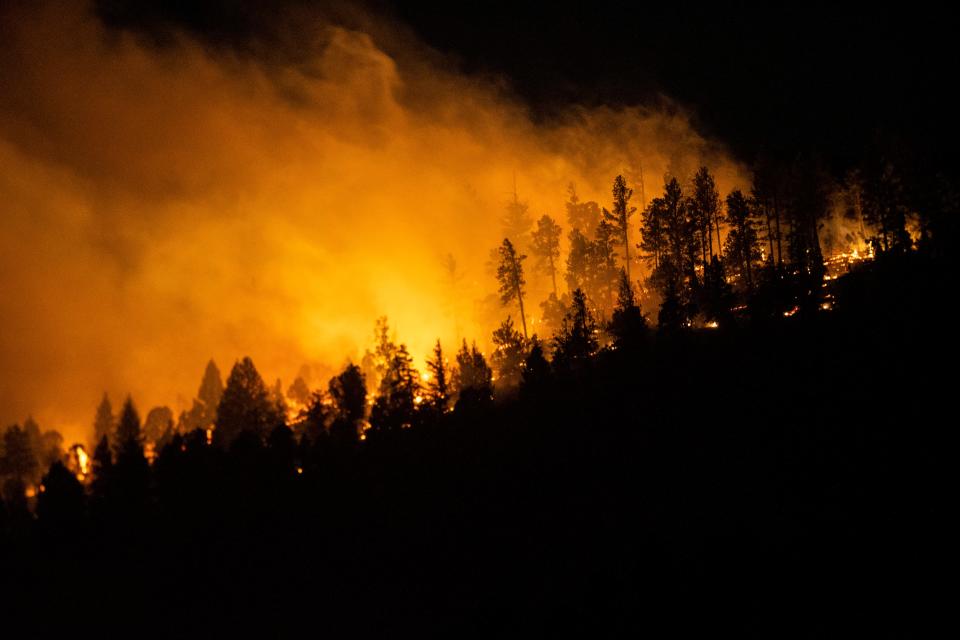 The McBride Wildfire burns in the heart of the village in Ruidoso, New Mexico, Tuesday, April 12, 2022.