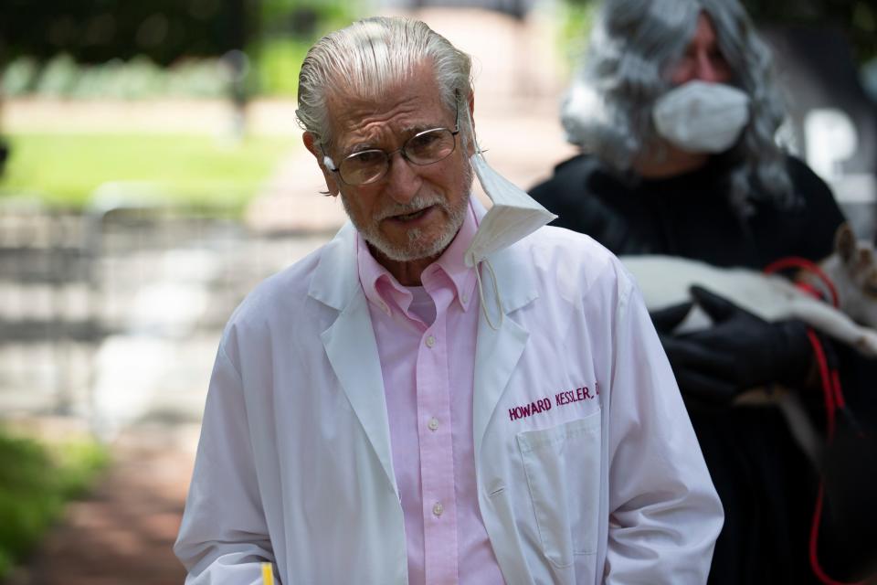 Dr. Howard Kessler of Tallahassee, a member of Physicians for Social Responsibility Florida, speaks during a demonstration staged in front of the Governor's Mansion in protest of the herd immunity approach to COVID-19 and Gov. Ron DeSantis' handling of the pandemic Wednesday, Sept. 23, 2020. 