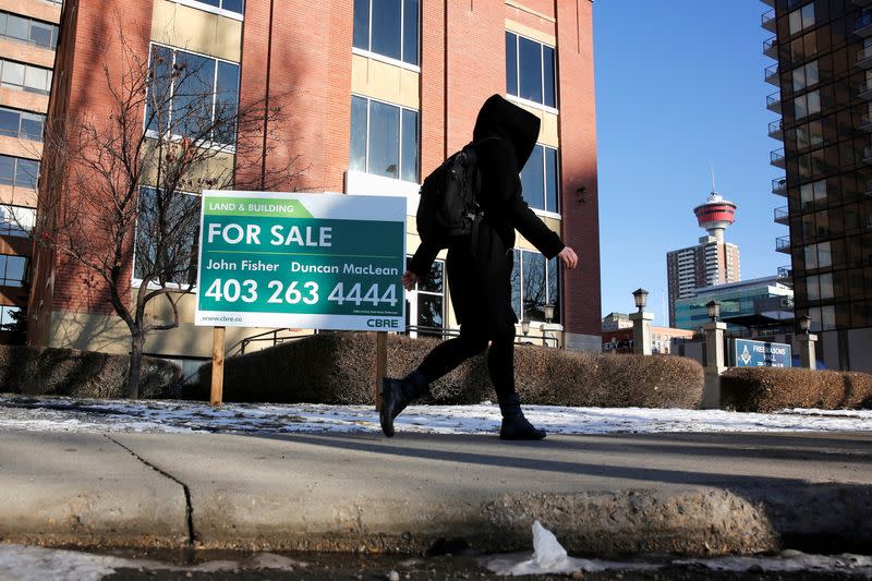 FILE PHOTO: A For Sale sign at a downtown office building in Calgary, Alberta, Canada