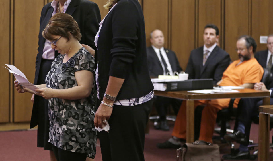 FILE - In this Thursday, Aug. 1, 2013 file photo, Michelle Knight speaks during the sentencing phase for Ariel Castro, right, in a Cleveland courtroom. The list of missing people in Cleveland makes up about one out of every 10 cases in the entire state. Most are found within a few weeks, but there are more than 22 people who have been gone for more than a year. (AP Photo/Tony Dejak, File)