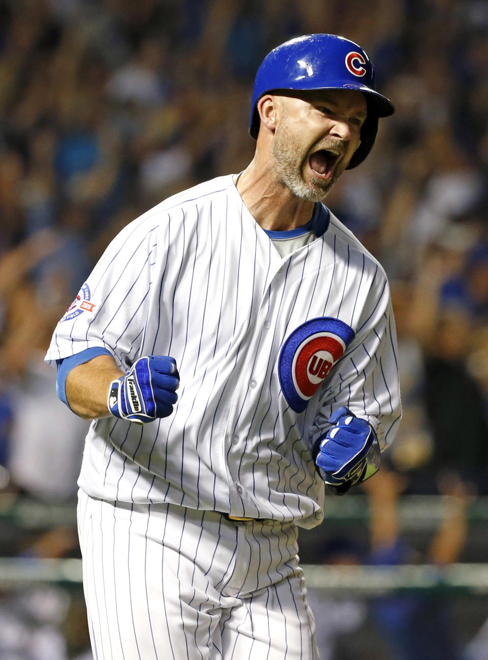 FILE- In this Sept. 25, 2016, file photo, Chicago Cubs' David Ross reacts as he rounds the bases after hitting a solo home run during the fifth inning of a baseball game against the St. Louis Cardinals in Chicago. The Cubs have hired former catcher David Ross to replace Joe Maddon as their manager, hoping he can help them get back to the playoffs after missing out for the first since 2014. (AP Photo/Nam Y. Huh, File)
