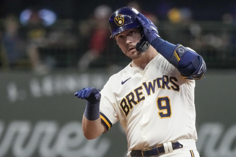 Milwaukee Brewers' Brian Anderson reacts after hitting a double during the seventh inning of a baseball game against the St. Louis Cardinals Wednesday, Sept. 27, 2023, in Milwaukee. (AP Photo/Morry Gash)