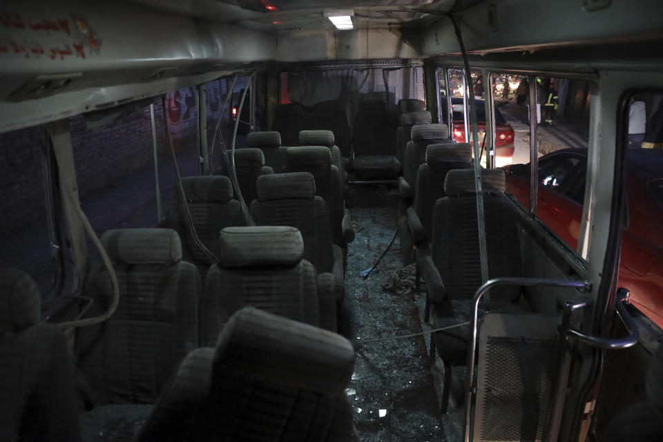 Shattered glass litters the inside of a mini-bus after a bomb attack in Kabul, Afghanistan, Monday, Dec. 28, 2020. (AP Photo/Rahmat Gul)