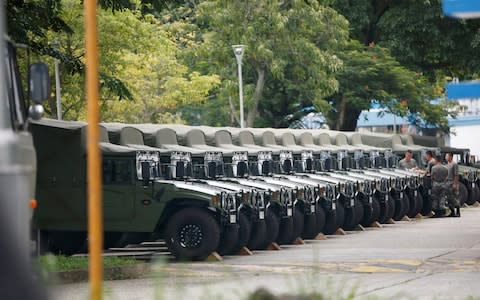 Troops and army jeeps at the Shek Kong military base of People's Liberation Army  - Credit: REUTERS/Staff